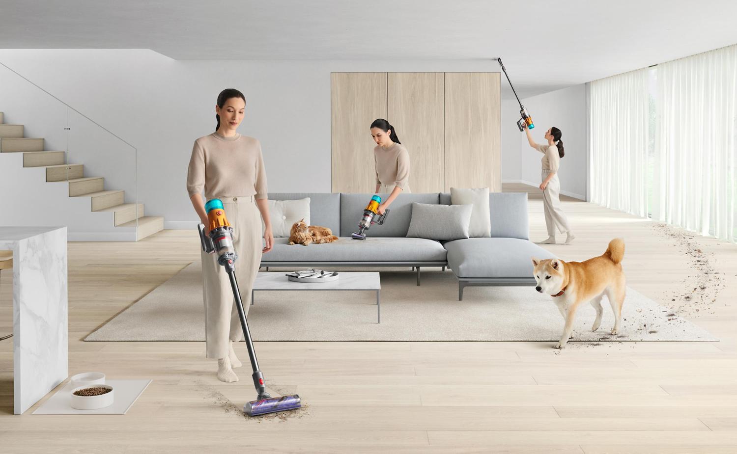 Dyson vacuum cleaner vacuuming living room with pets